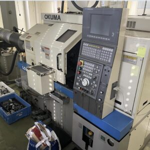OKUMA LCS15 cnc esztergagép szálvezetővel